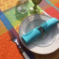 Round coated Jacquard tablecloth "Maussane" Orange and turquoise