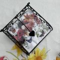 Paper napkins holder, metal and foliage
